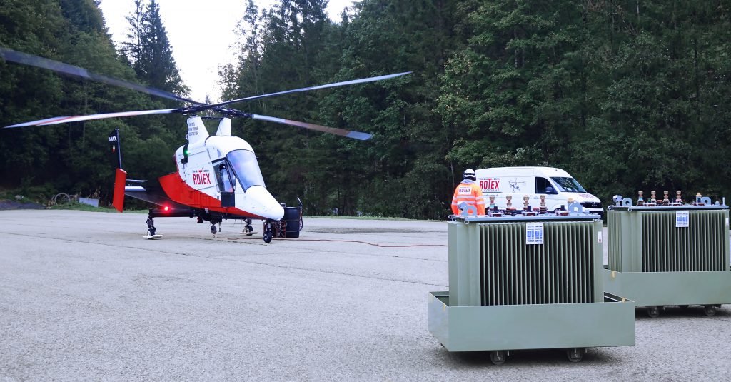 Transformers being transported with helicopter