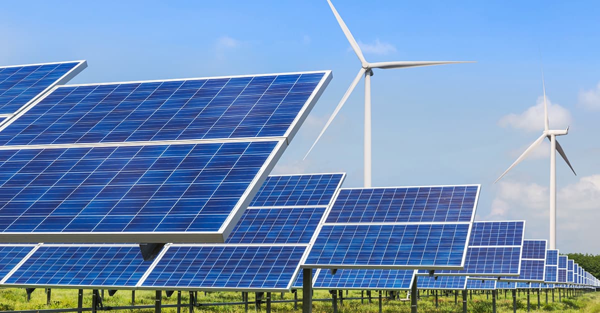 photovoltaics and wind turbines generating electricity in solar power station alternative energy from nature